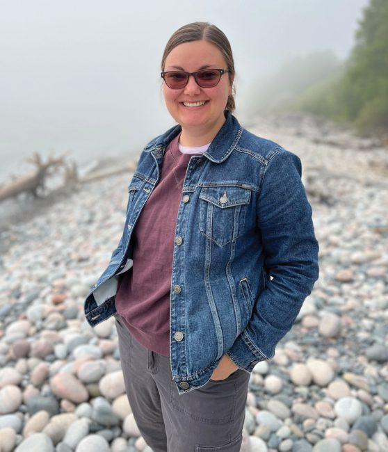 Dr. Heather Laakso posing by the lake