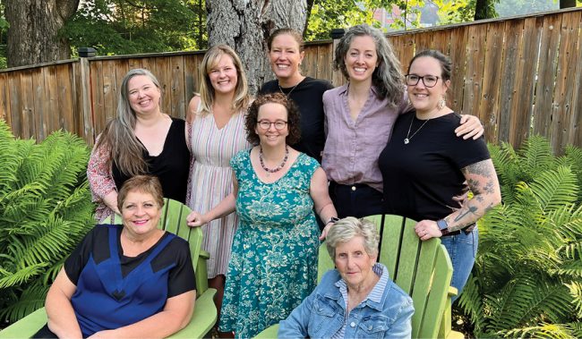 A group of women posing for a photo